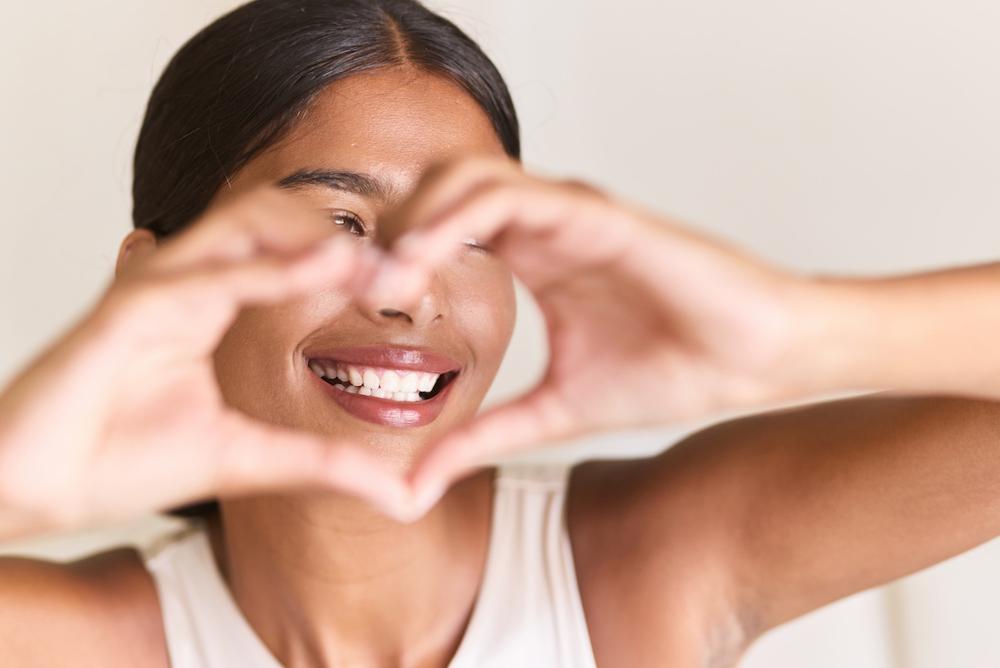 a patient making a heart sign