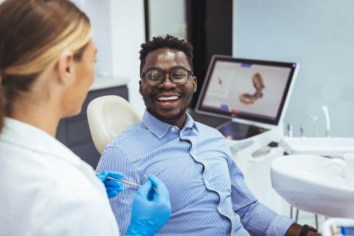 Man smiling during dental consultation in Vienna VA
