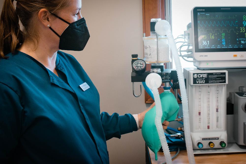 Woman preparing to administer General Anesthesia in Vienna Family Dental